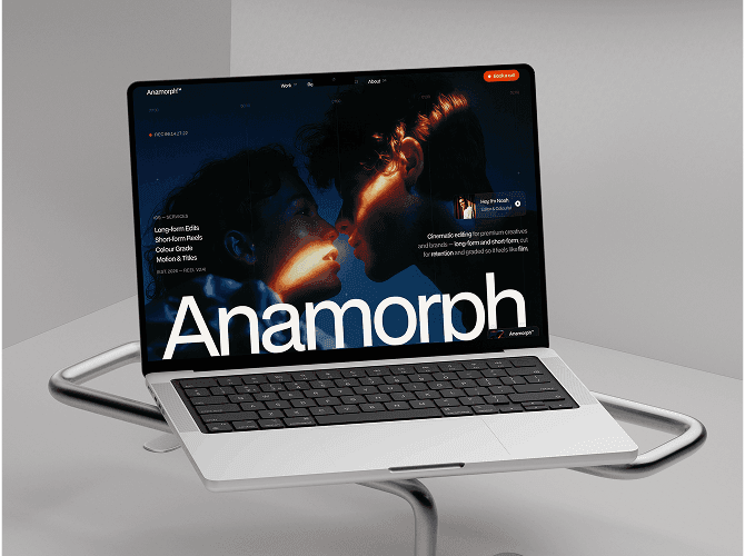 Anamorph Framer portfolio template on a MacBook on a metal stand, cinematic hero with a film still and large name, a dark template for video editors and studios