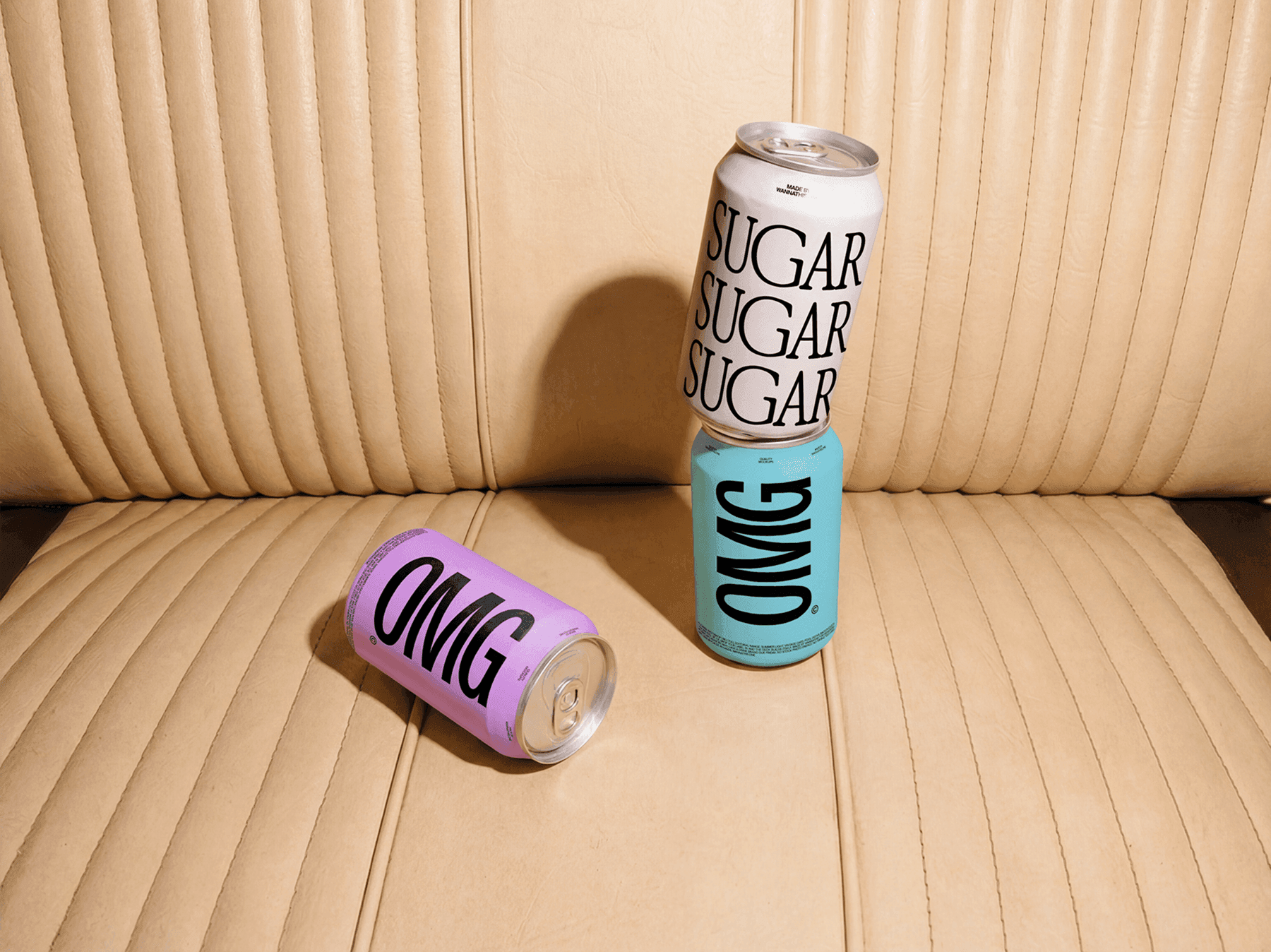 Multiple beverage can mockups placed on a vintage car seat