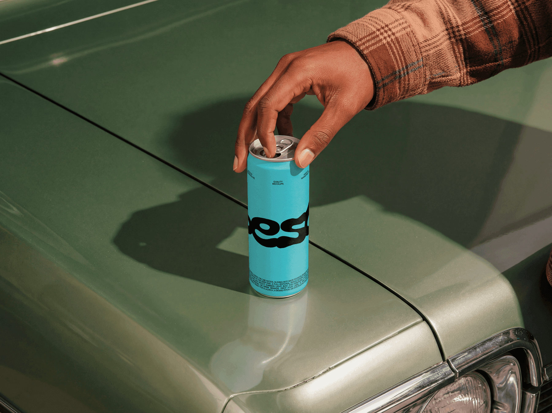 Slim beverage can mockup placed on the hood of a classic car