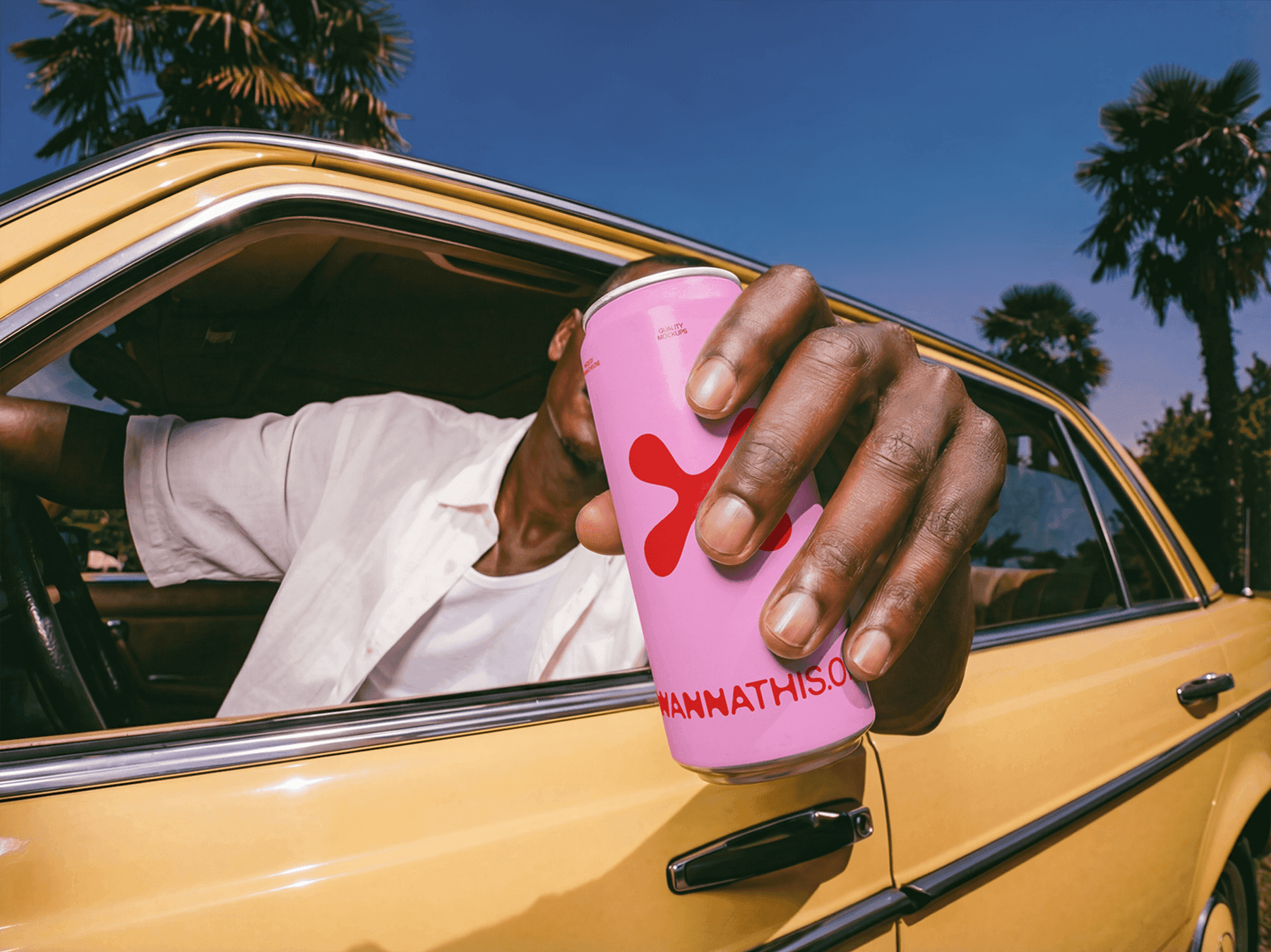 Lifestyle beverage can mockup held outside a vintage car window