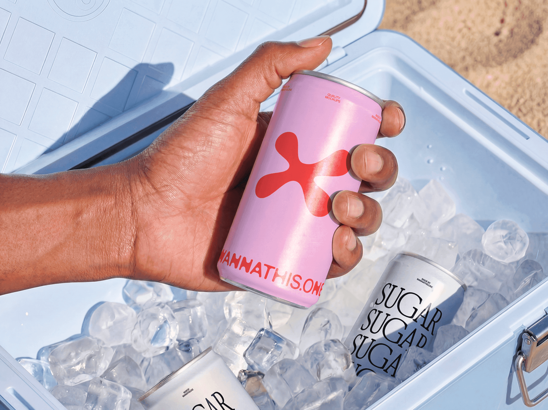 Hand holding a beverage can mockup above an ice-filled cooler