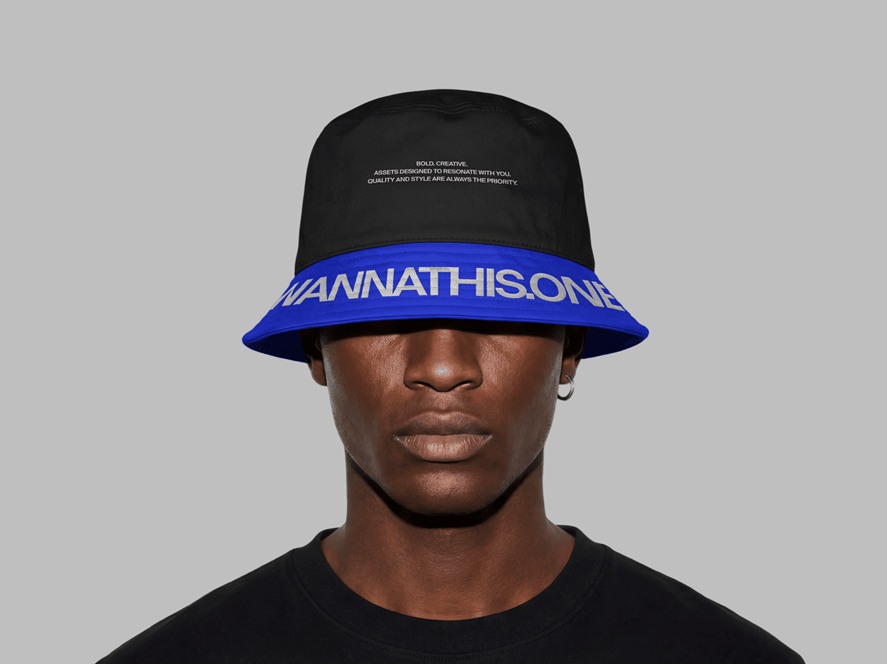 Bucket hat mockup worn by a model in a front-facing studio portrait