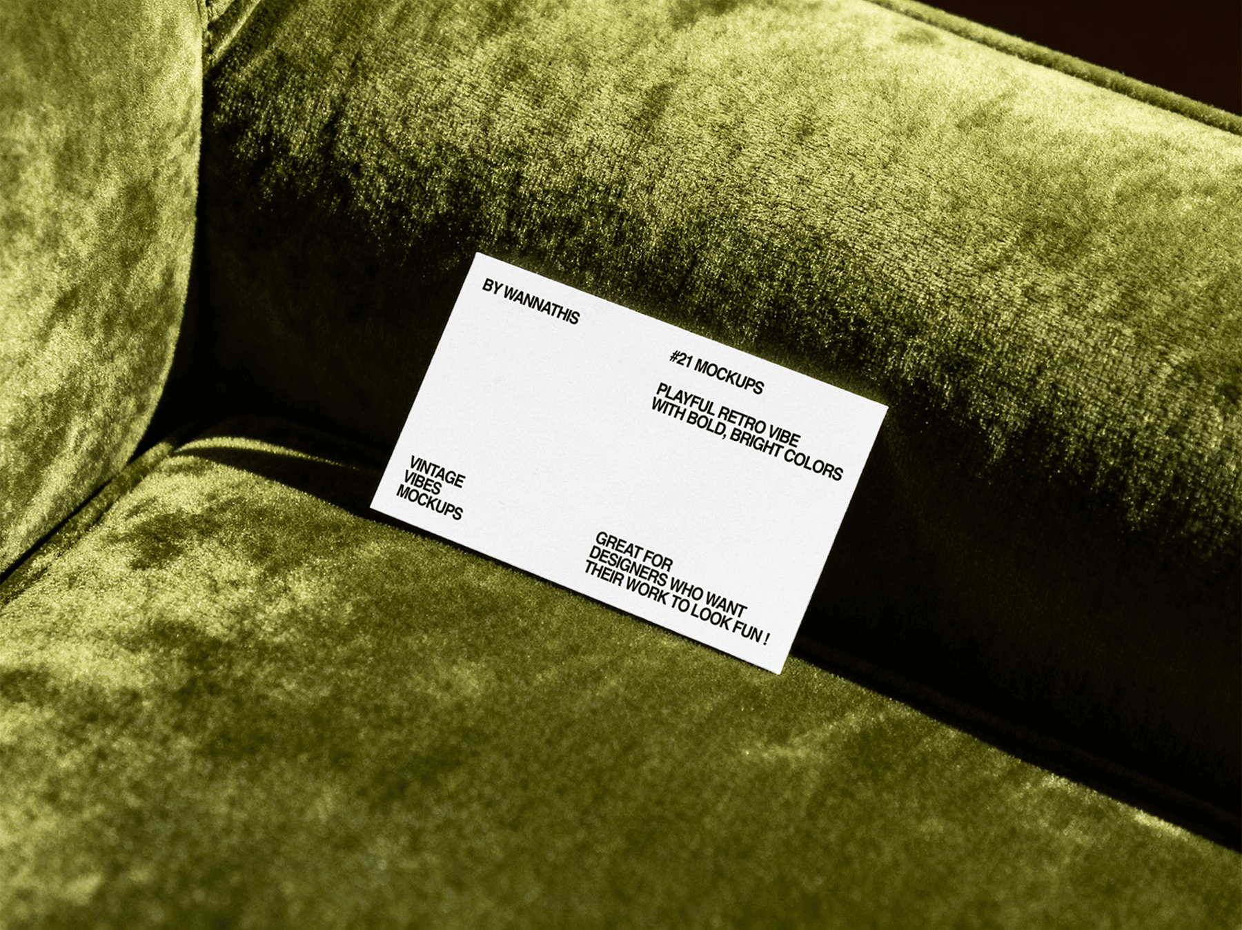 Business card mockup placed on a soft sofa surface