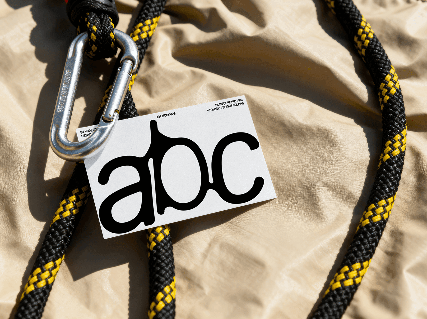 Creative business card mockup hanging with rope and metal carabiner