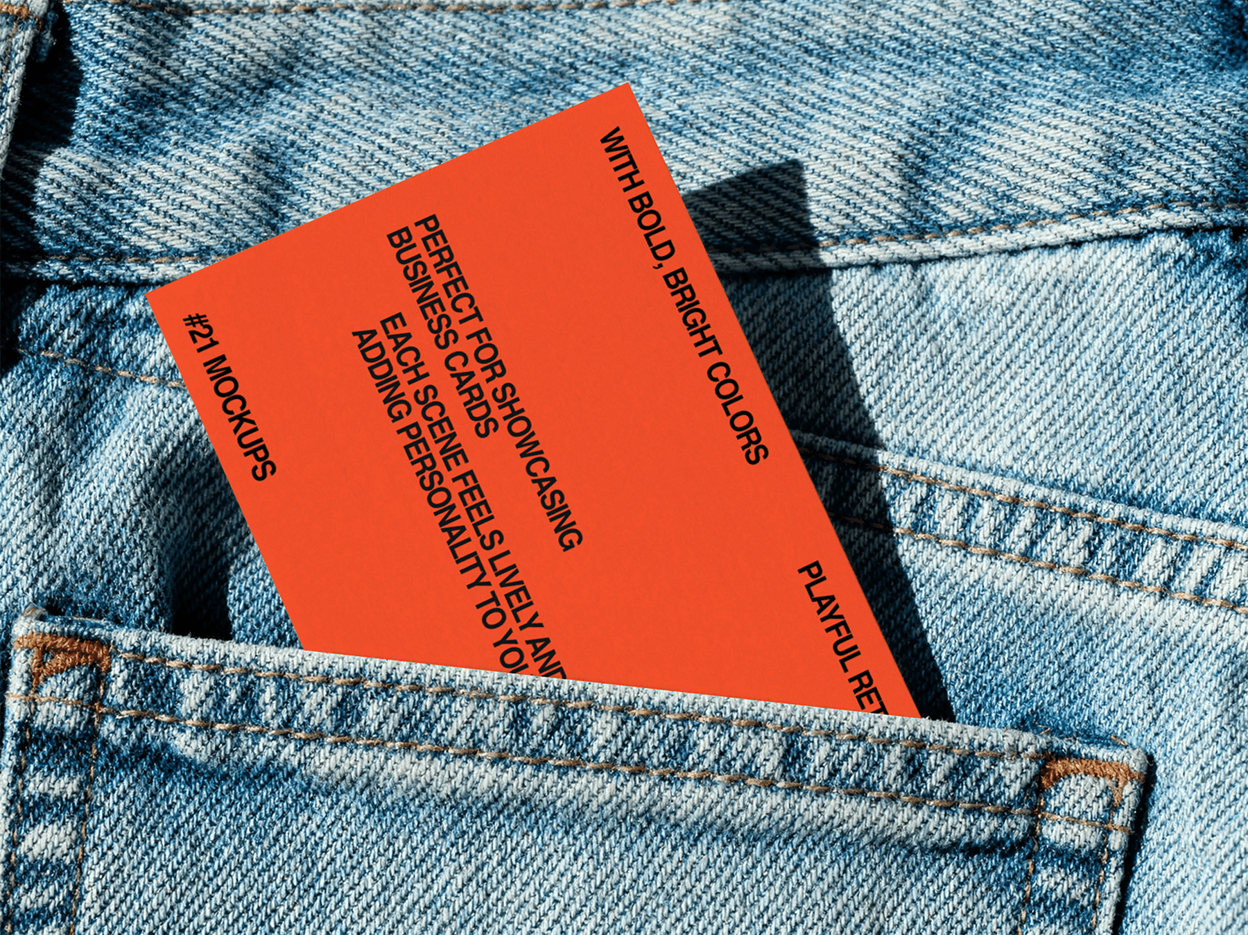 Business card mockup tucked inside a denim pocket