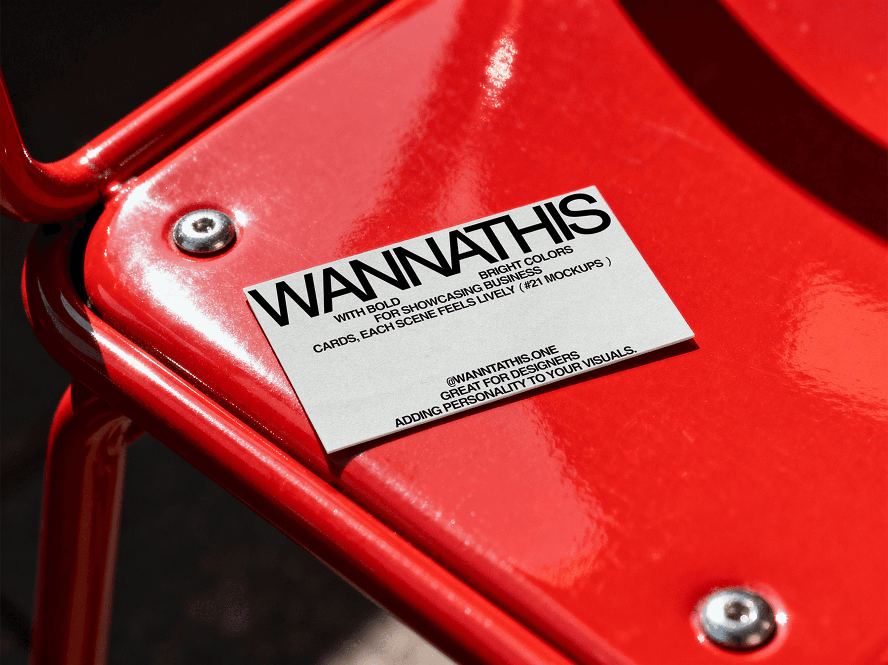 Business card mockup placed on a red metal chair