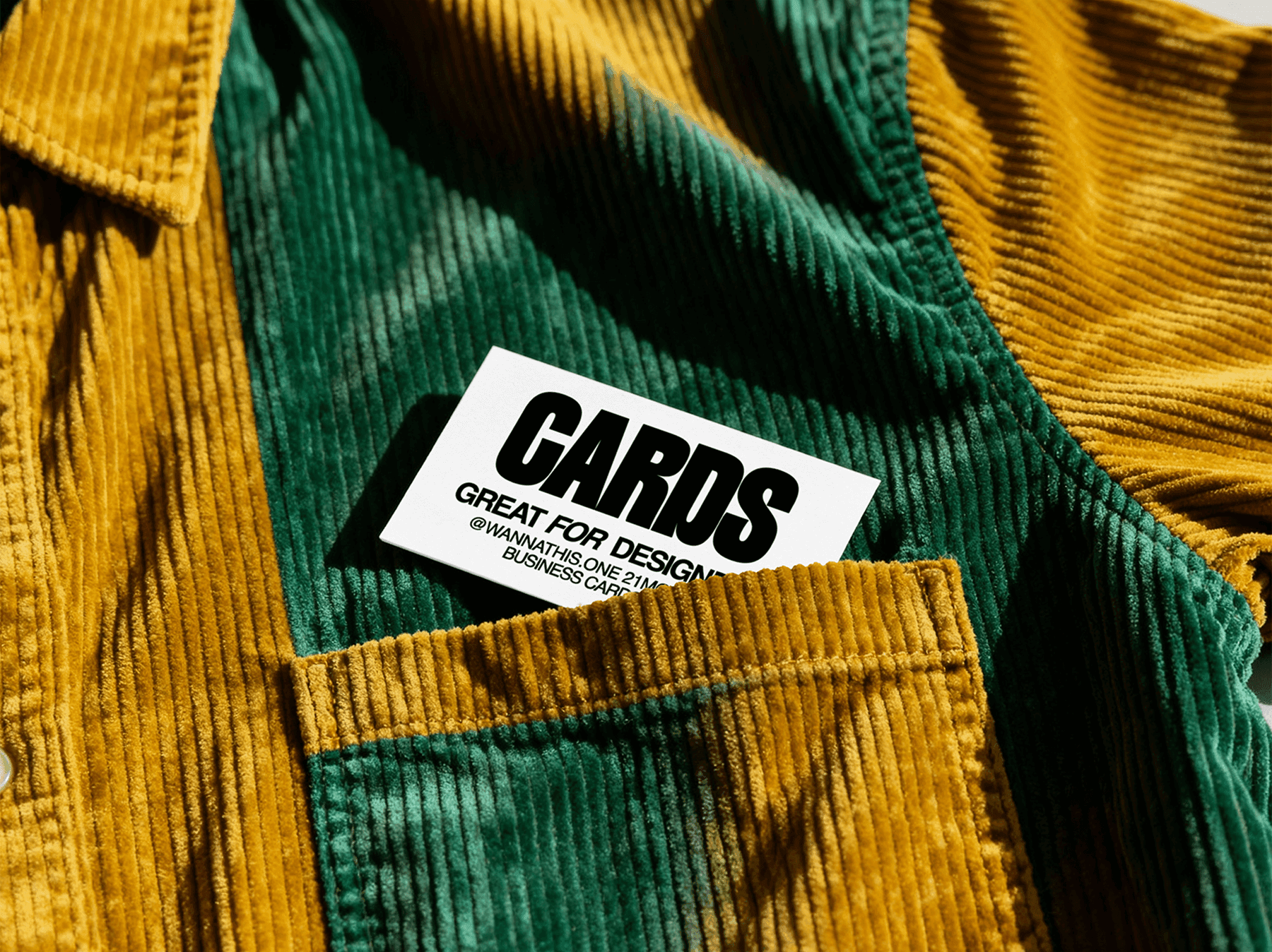 Business card mockup placed inside a shirt pocket with natural light