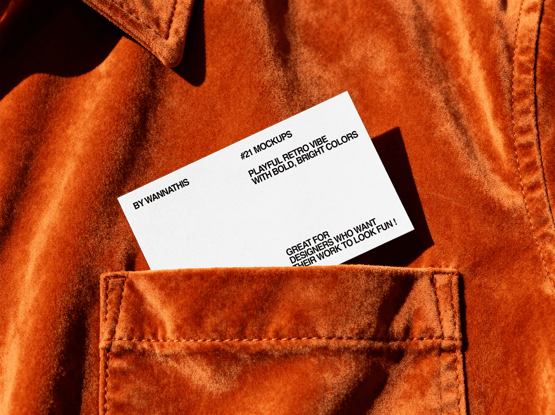 Simple business card mockup resting on textured fabric surface
