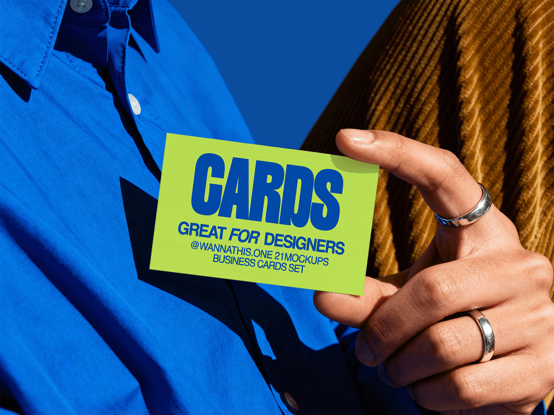 Person holding a business card mockup against a plain background