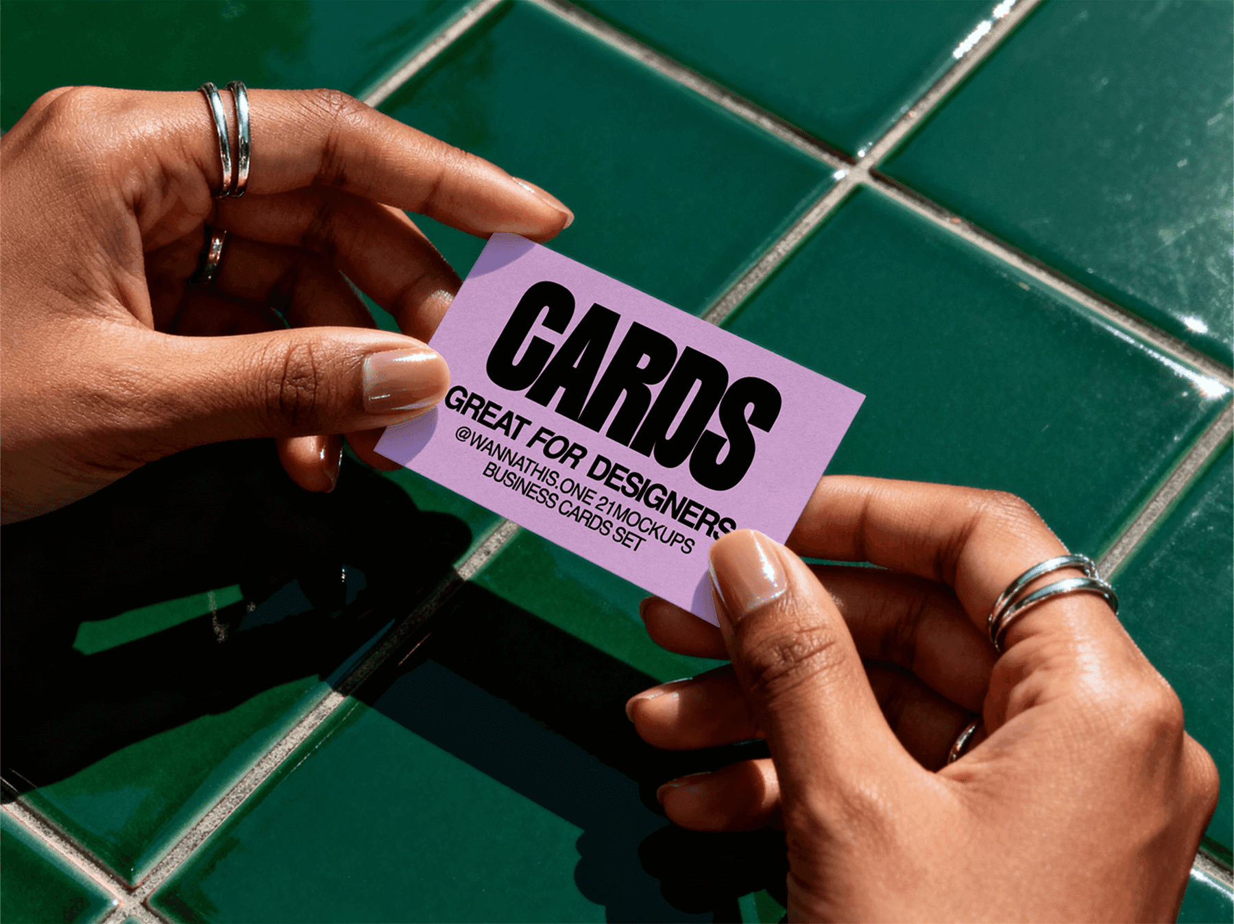 Business card mockup lying on a glossy tile surface