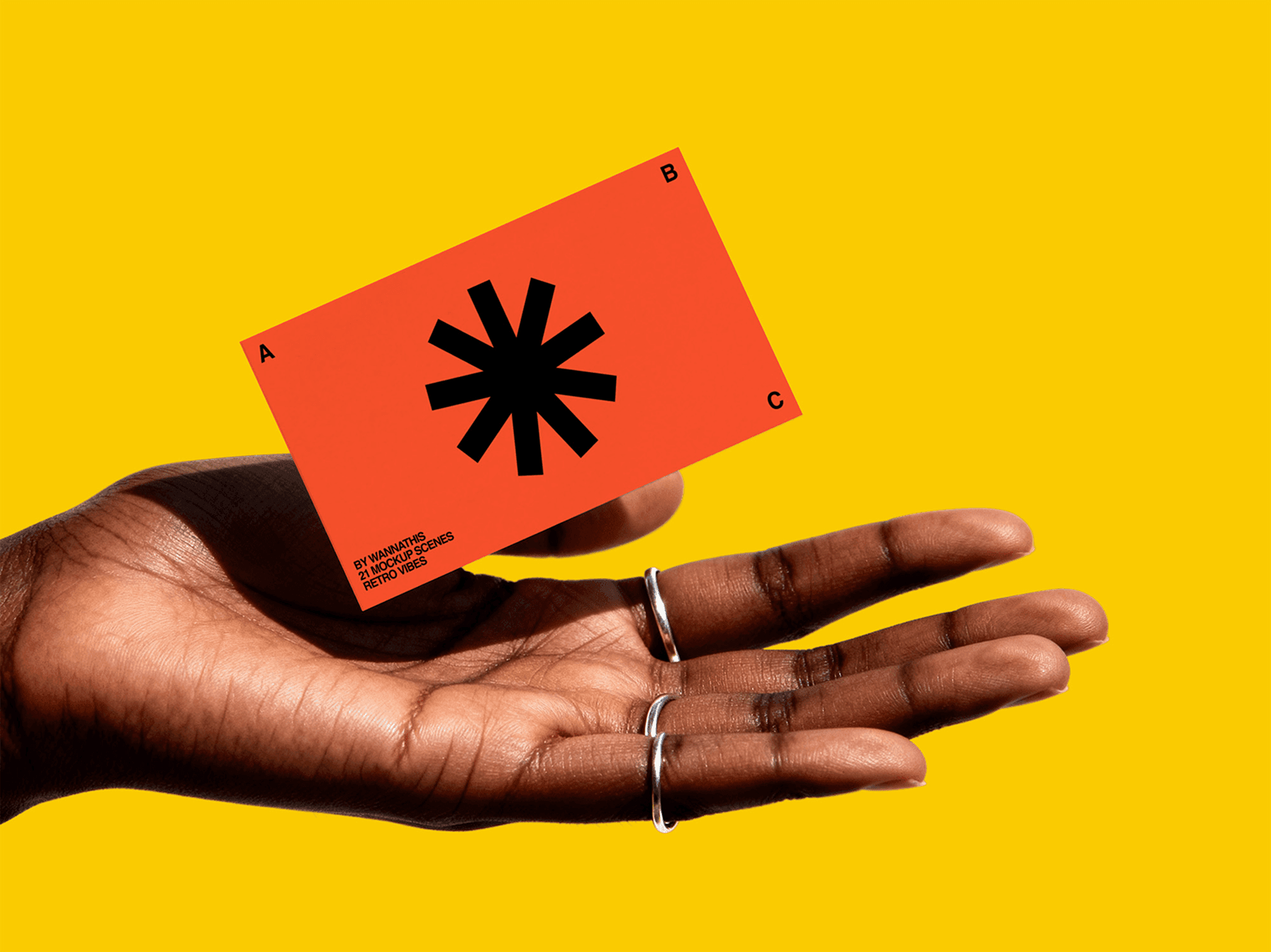 Close-up of a hand holding a modern business card mockup