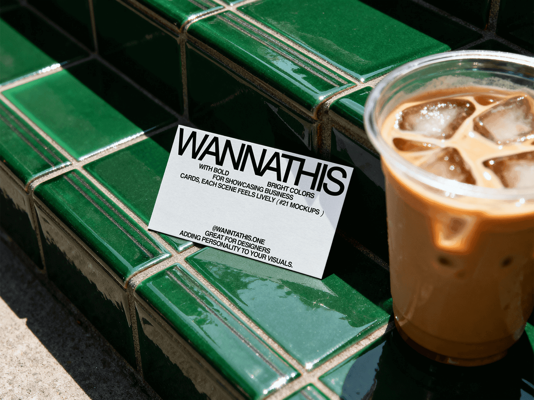 Business card mockup resting on green tile step near a drink