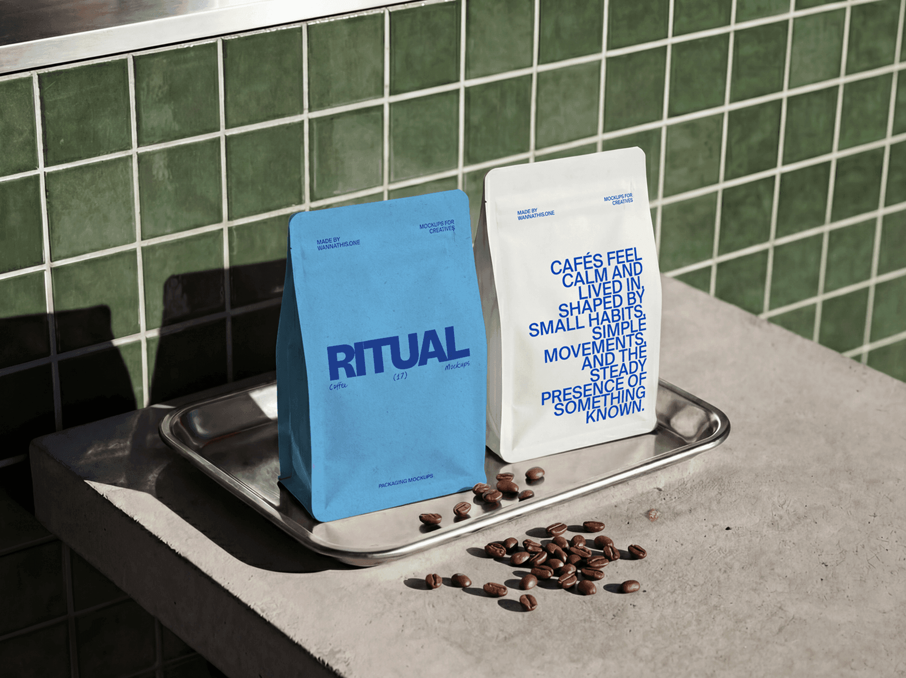 Coffee packaging bags displayed on a metal tray with coffee beans