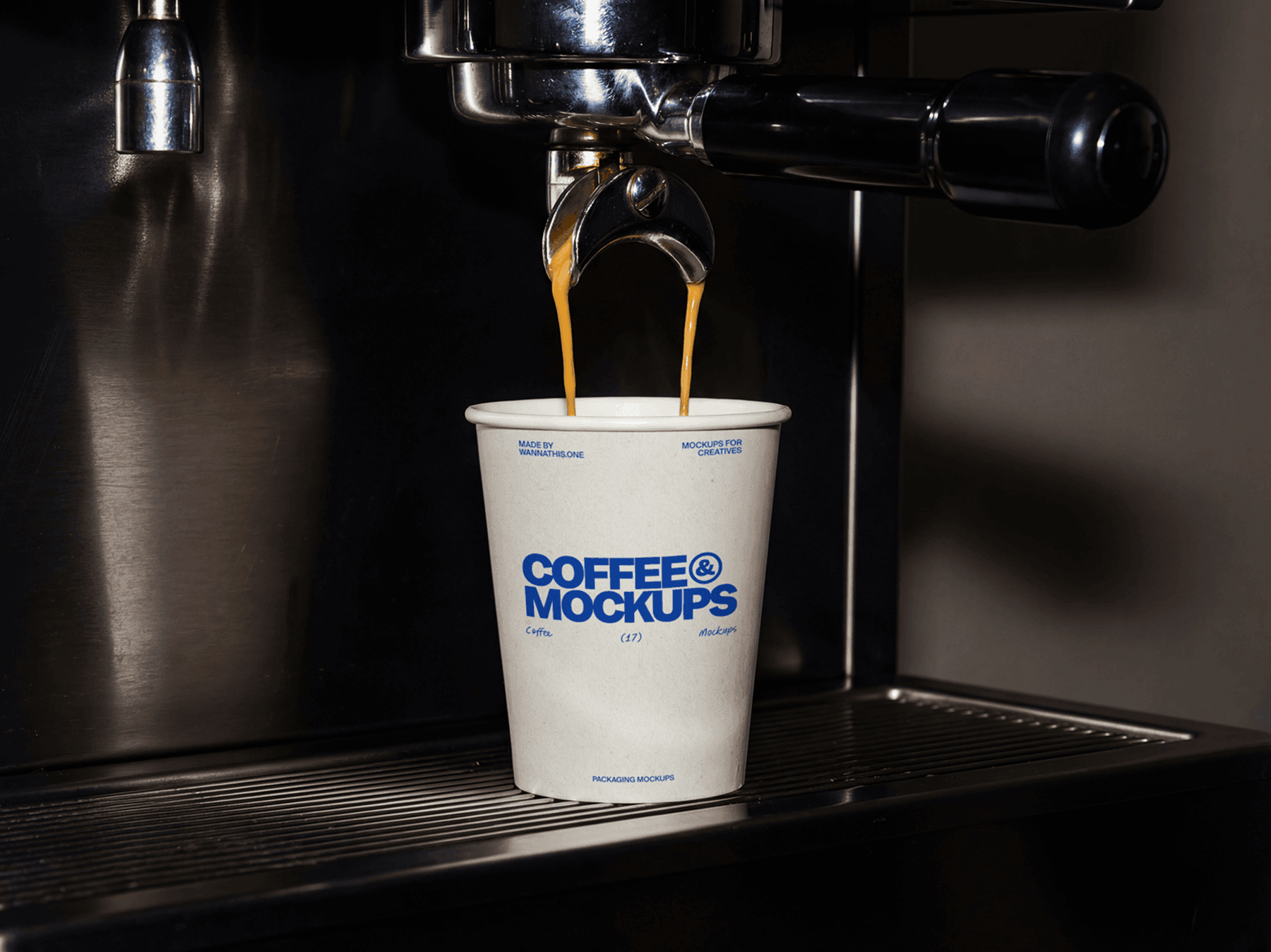 Takeaway coffee cup on a coffee machine tray during preparation