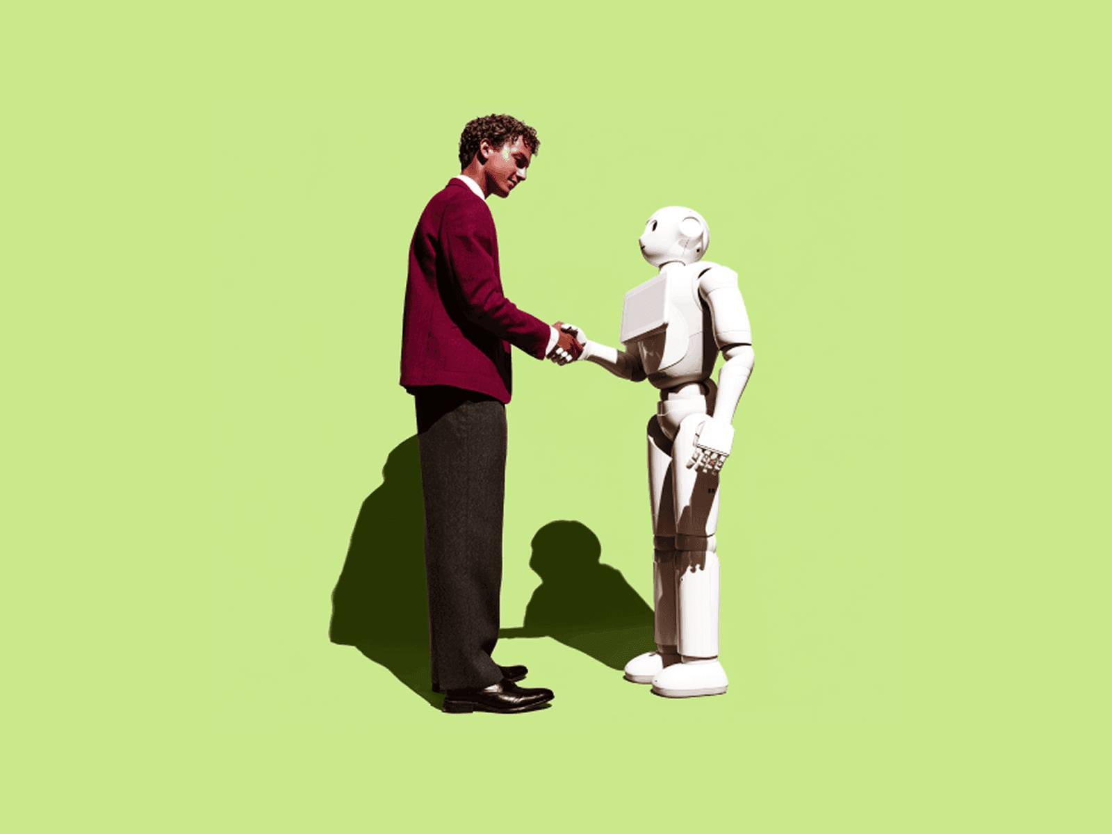 Designer shaking hands with humanoid robot on green background AI and design collaboration concept