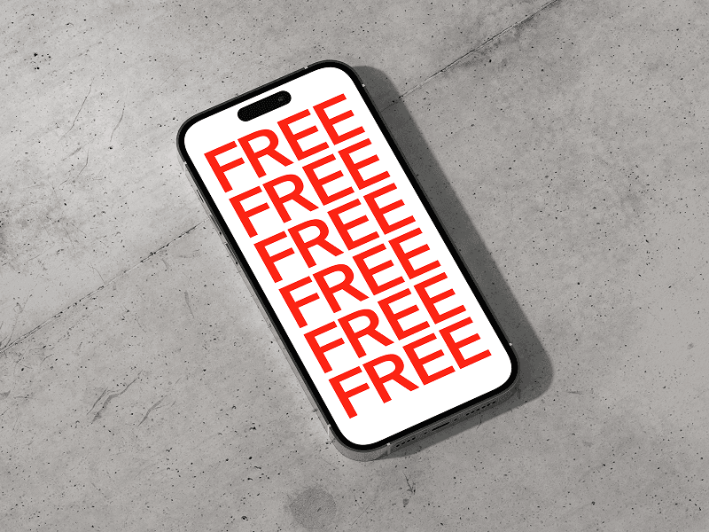 iPhone 16 Pro mockup by Wannathis with bold red repeated text “FREE” on screen placed on gray concrete surface
