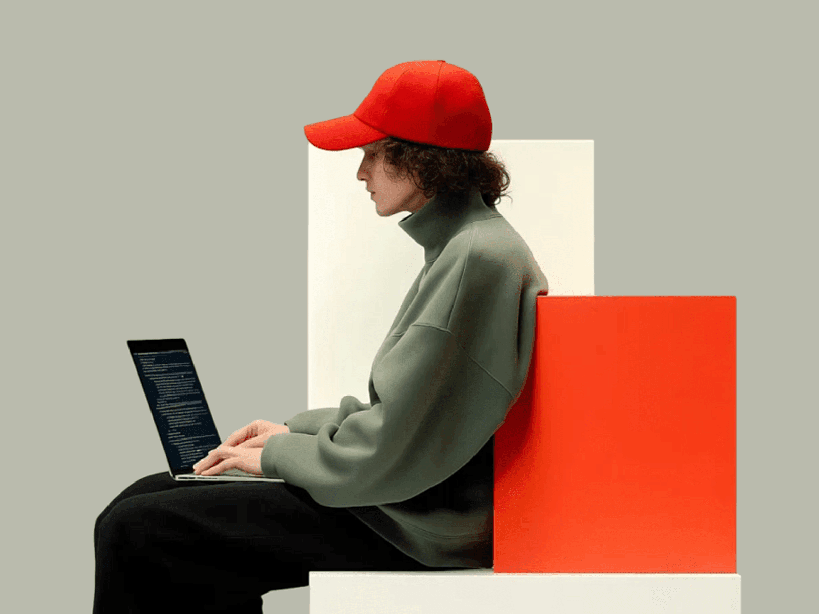 Side-profile photo of a person working on a laptop, clean aesthetic imagery for a Wannathis design presentation article 