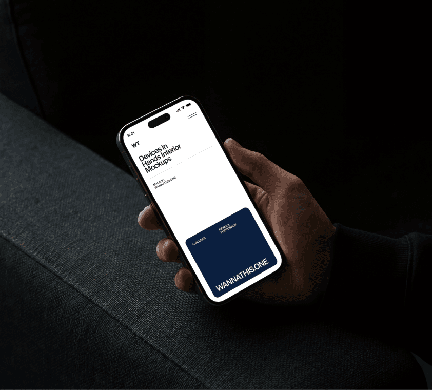 iPhone in hand mockup in dark interior setting with realistic lighting and shadows