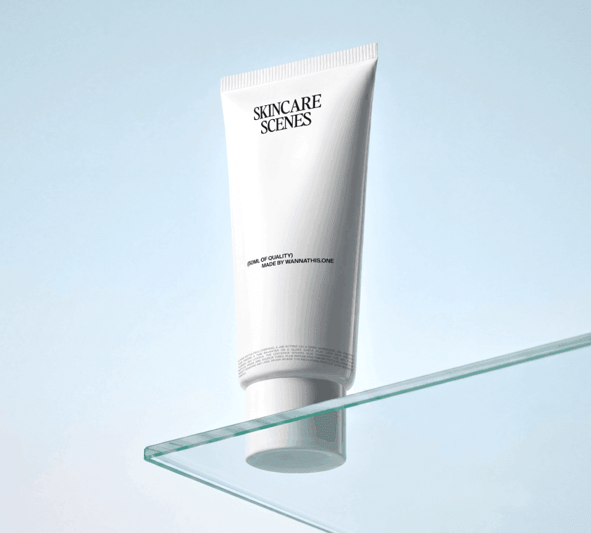Skincare tube mockup standing on the corner edge of a thin glass shelf in soft studio light.