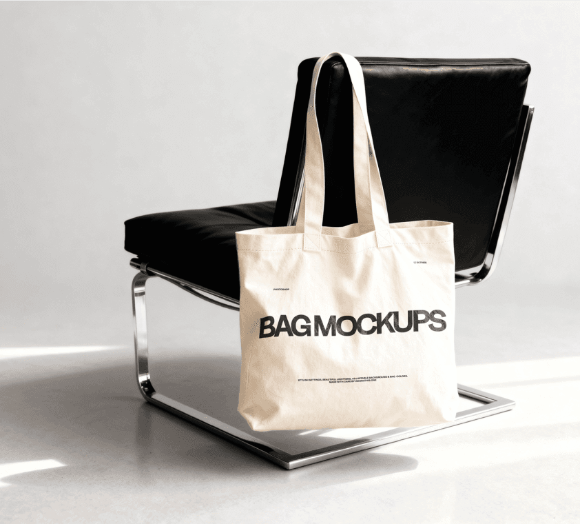 Canvas tote bag mockup placed on modern chair with editable logo design
