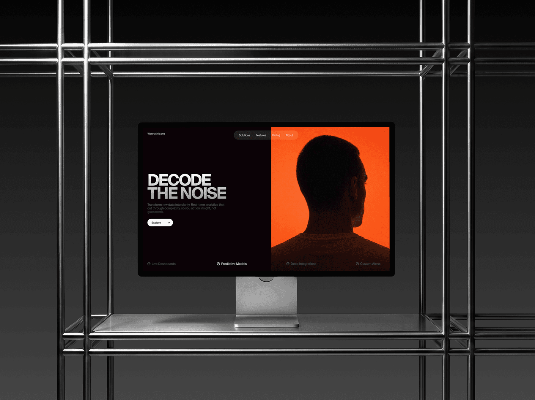 Apple Studio Display placed inside a metal frame structure