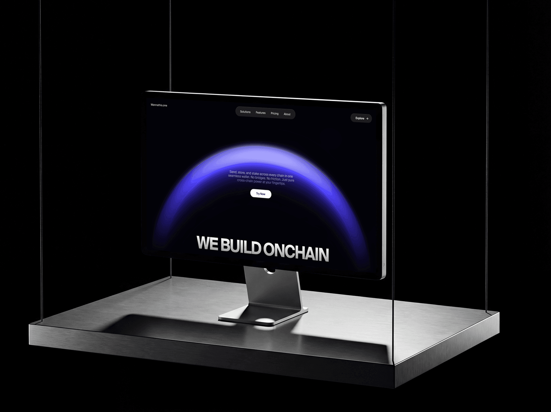 Apple Studio Display placed inside a glass case on a platform