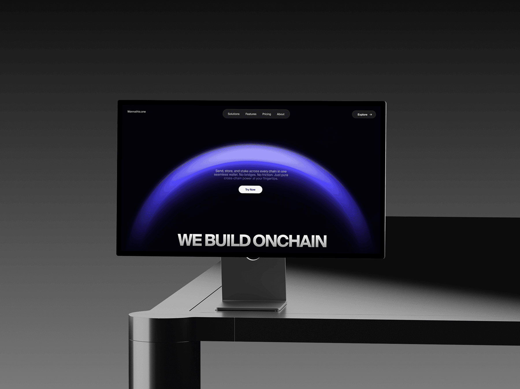 Apple Studio Display placed on the edge of a desk in a dark studio