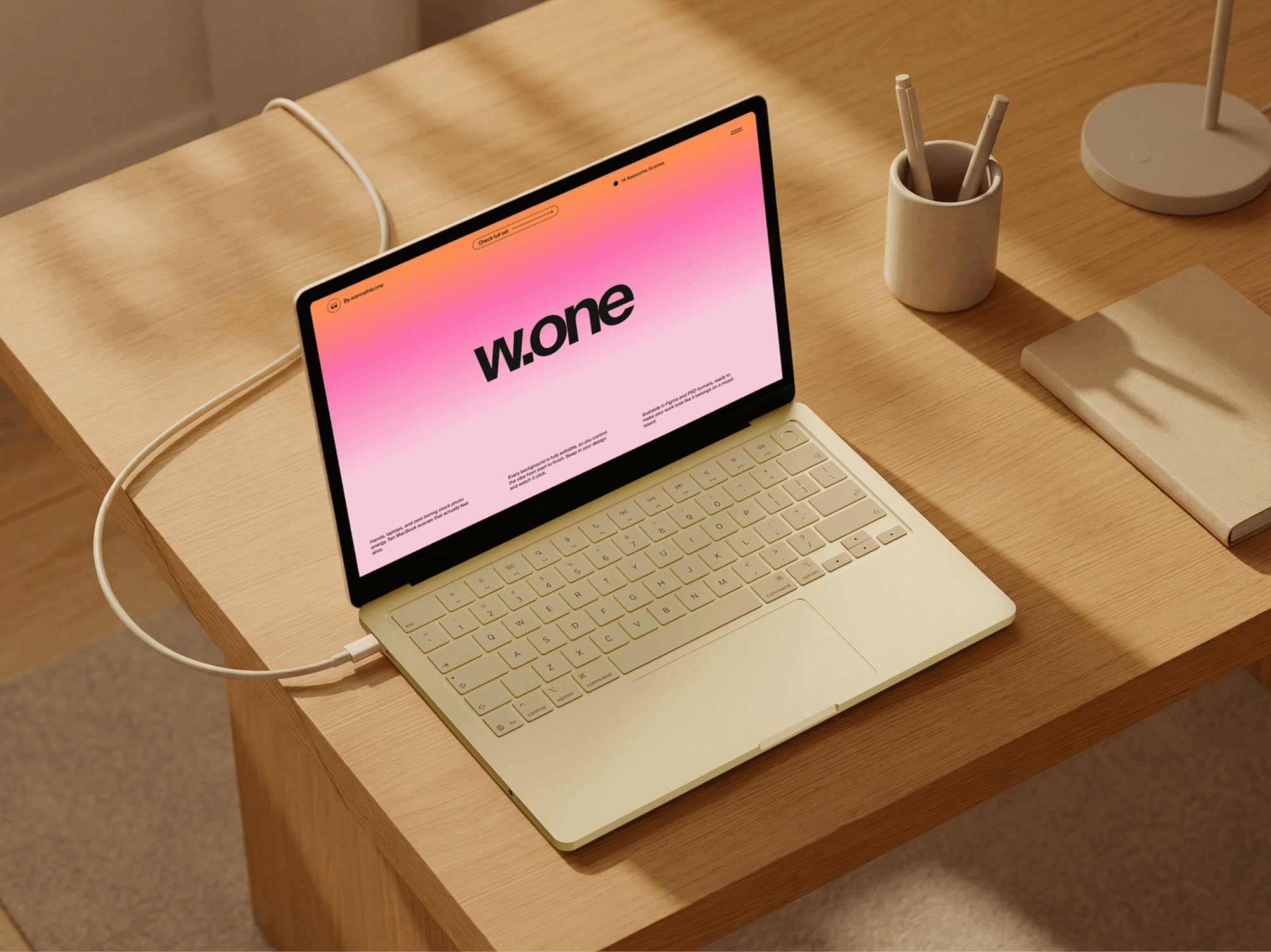 MacBook mockup on a clean minimal wooden desk with office accessories in soft daylight interior