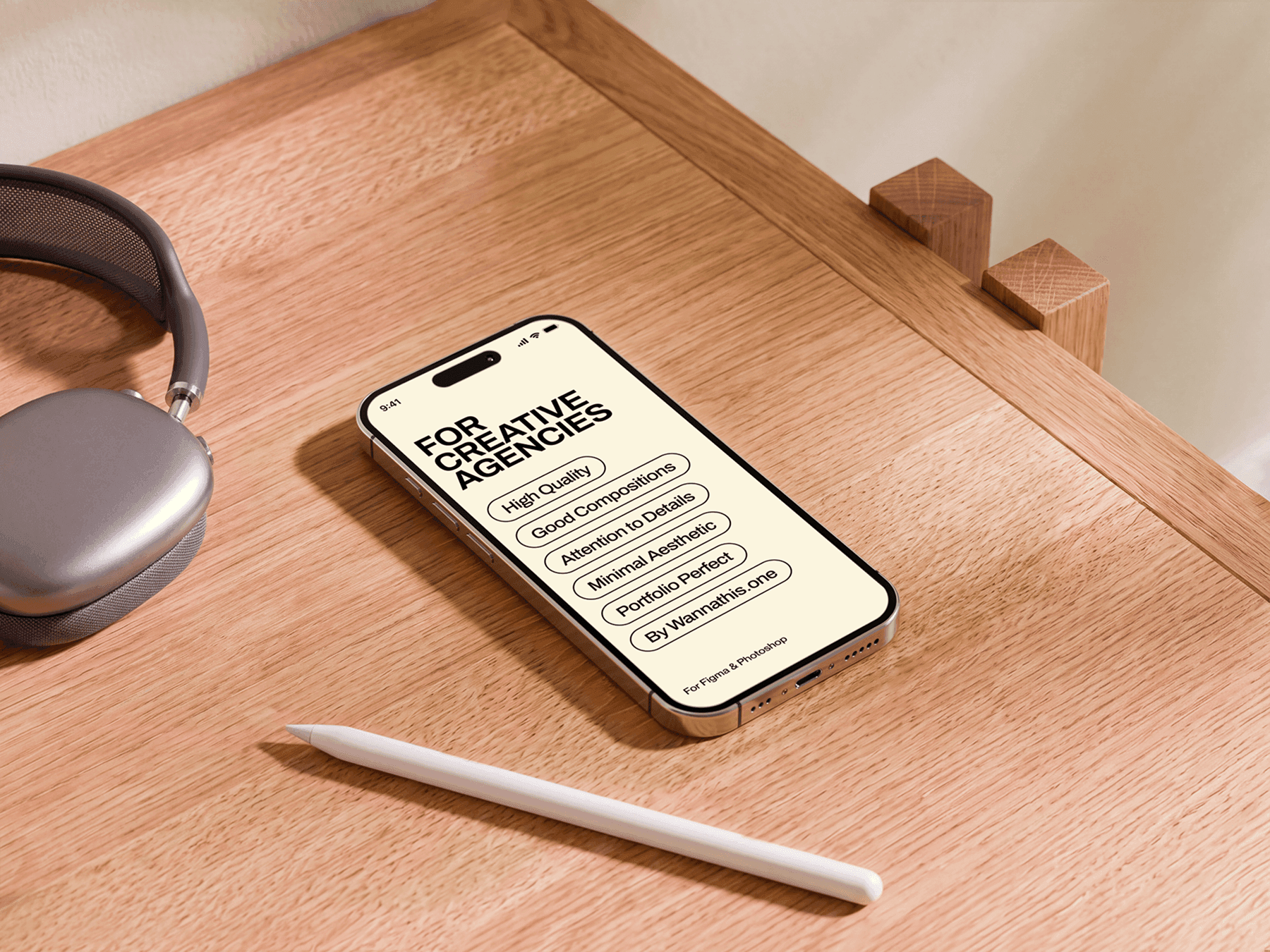 iPhone mockup placed on the corner edge of a warm wooden desk with charging cable in a refined natural scene