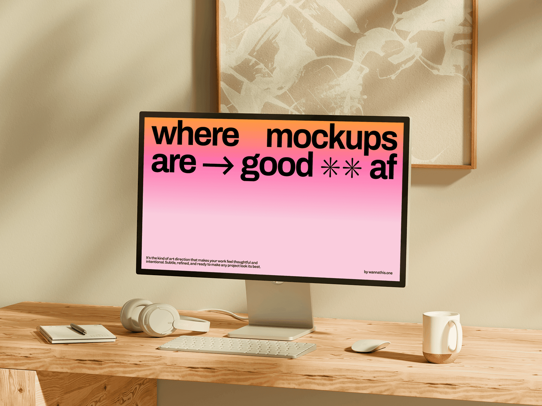 Monitor mockup placed on a wooden desk with workspace accessories