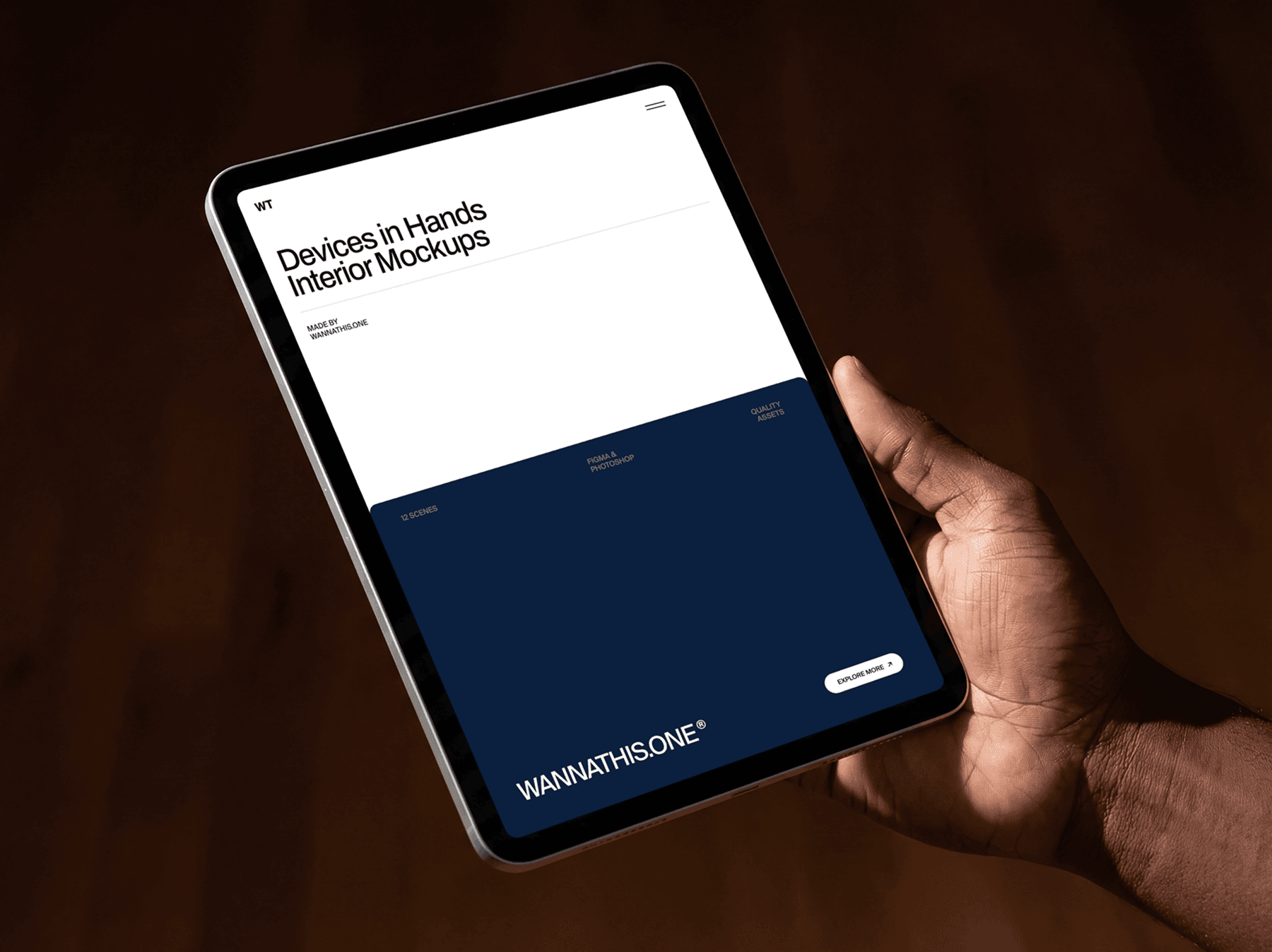 Close-up of a person holding a tablet with one hand indoors