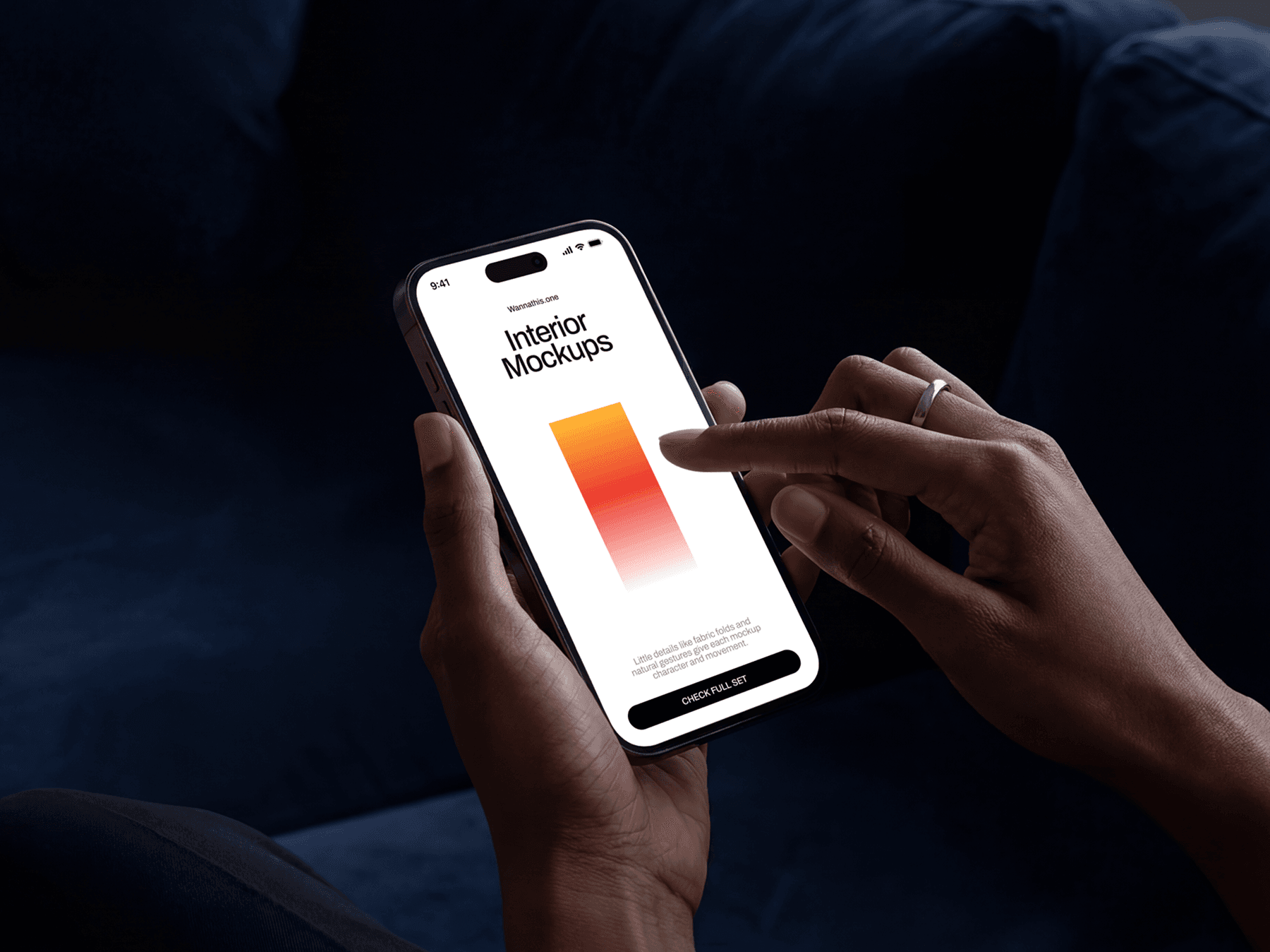 Person using an iPhone with a finger touching the screen while seated indoors