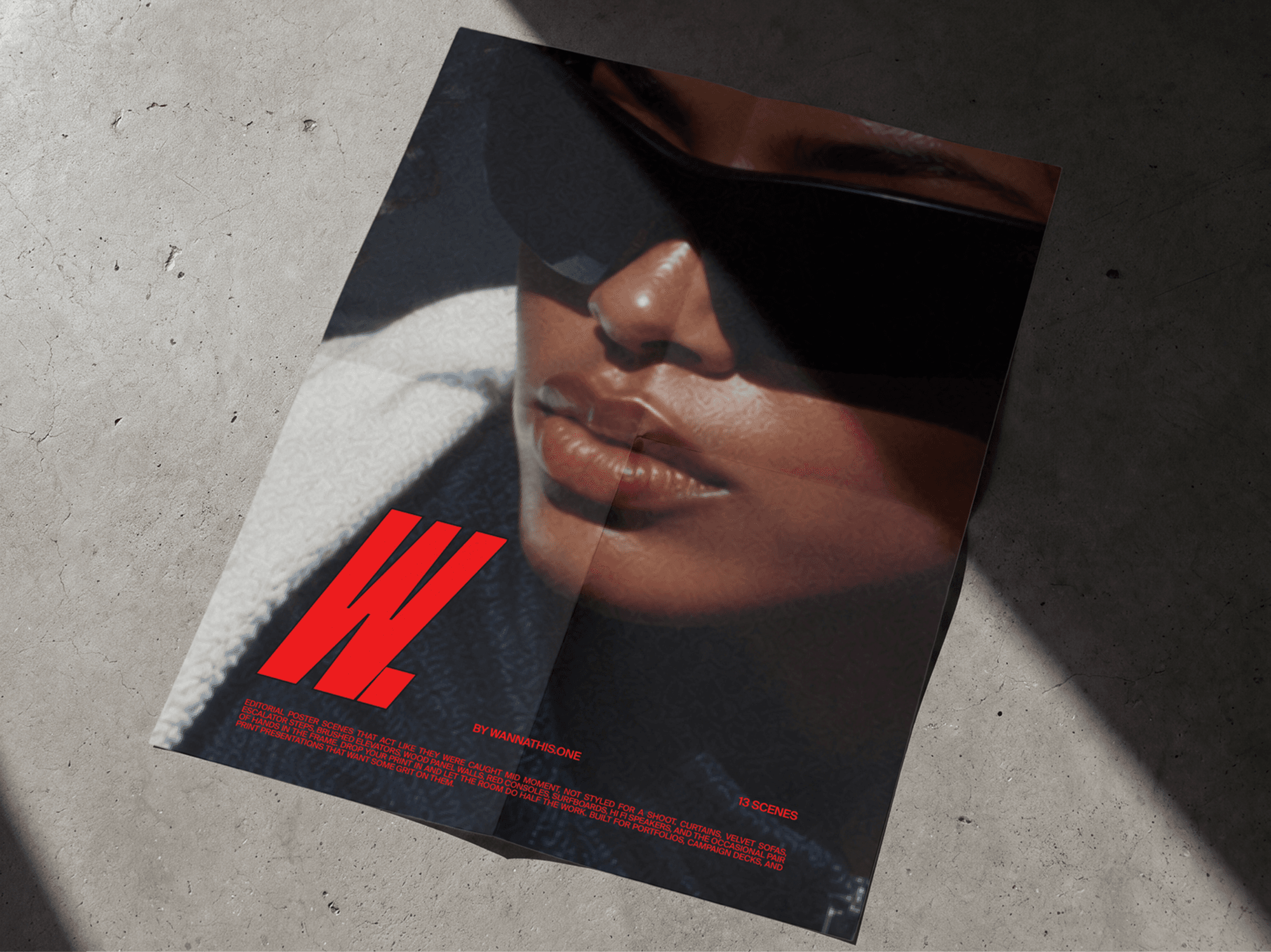 Fashion editorial poster mockup placed on a raw concrete floor with sharp realistic shadows in modern scene