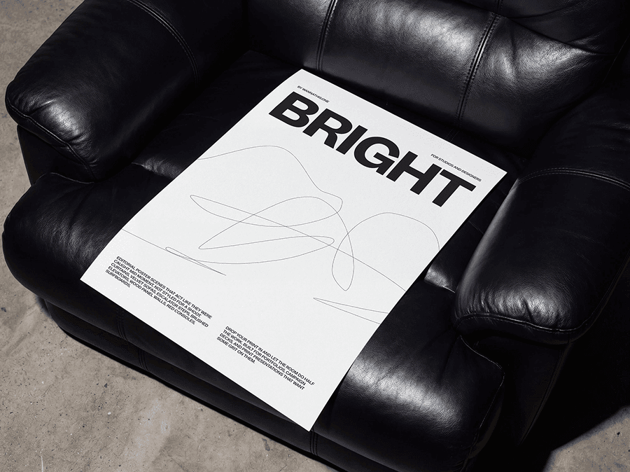 Editorial poster mockup placed on a refined leather armchair seat in a warm modern interior scene