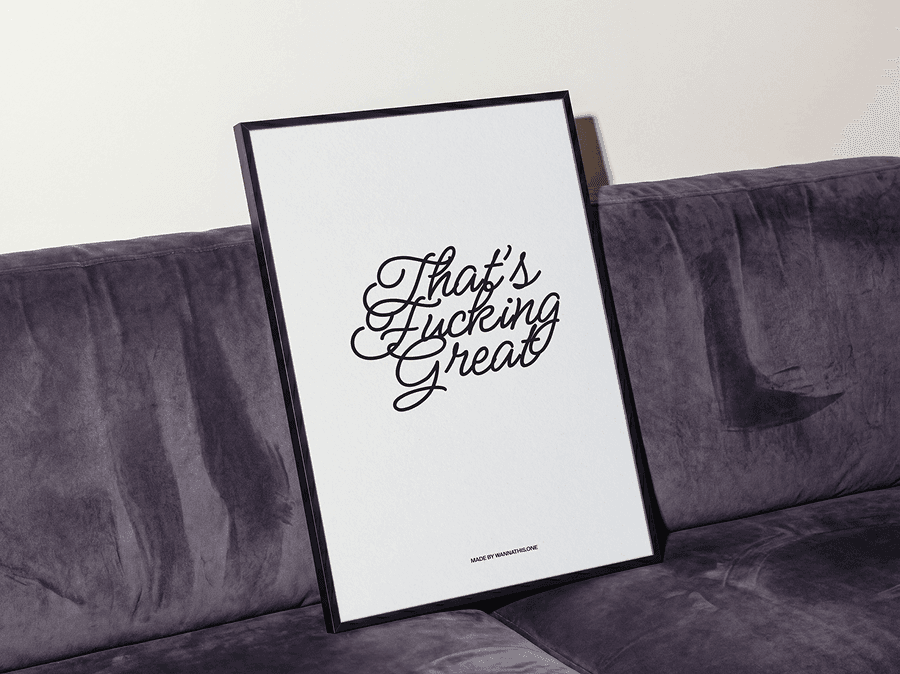 Framed typography poster mockup leaning on a soft refined sofa in a clean minimal interior studio scene
