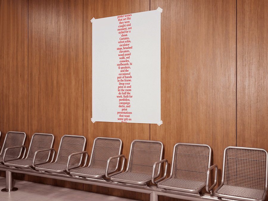 Vertical poster mockup attached to a warm wooden wall above refined metal chairs in a clean waiting area scene