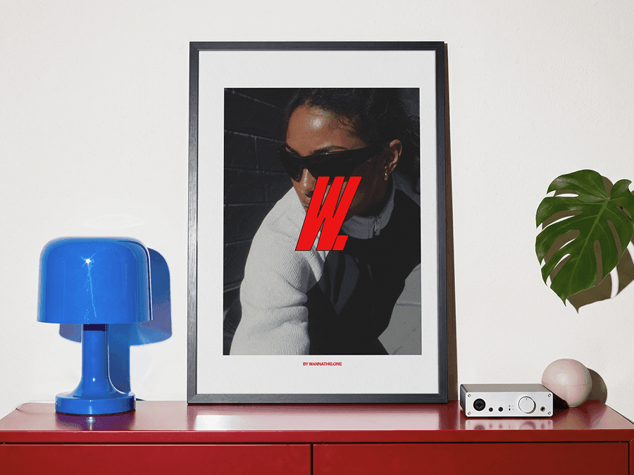 Framed editorial poster mockup displayed in a refined modern interior scene with directional natural light