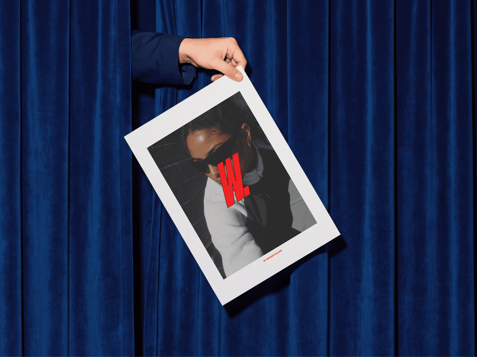 Person holding an editorial poster mockup in front of soft refined curtains in a clean indoor lifestyle scene