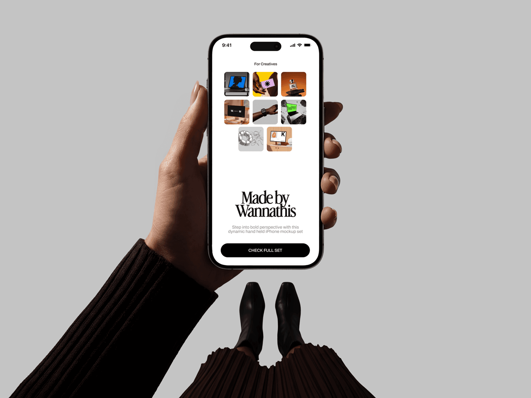 Hand holding an iPhone mockup from a top-down perspective