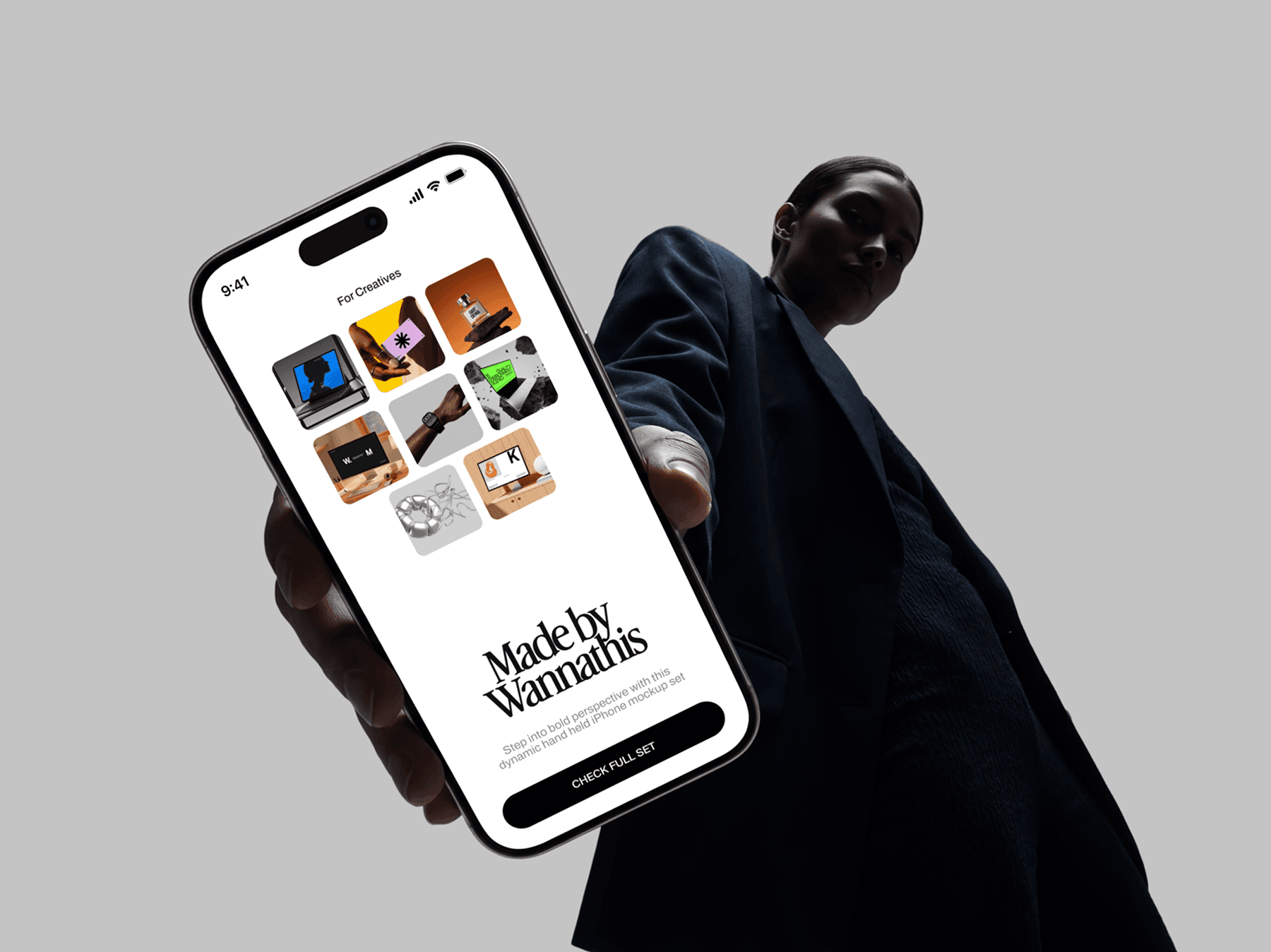 Low angle view of a person holding an iPhone mockup in hand
