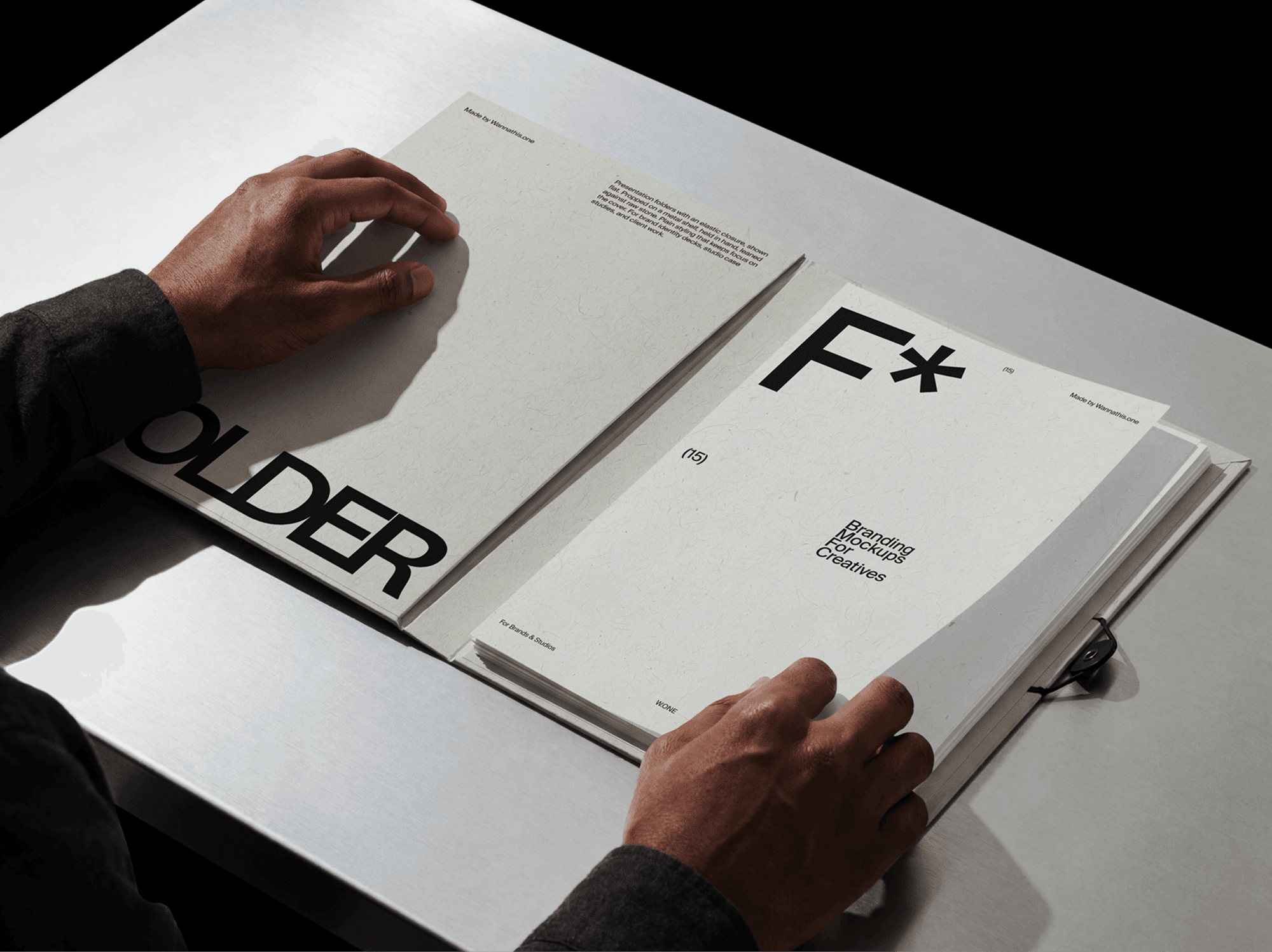 Presentation folder mockup opened on a desk with printed documents in a refined workspace lifestyle scene
