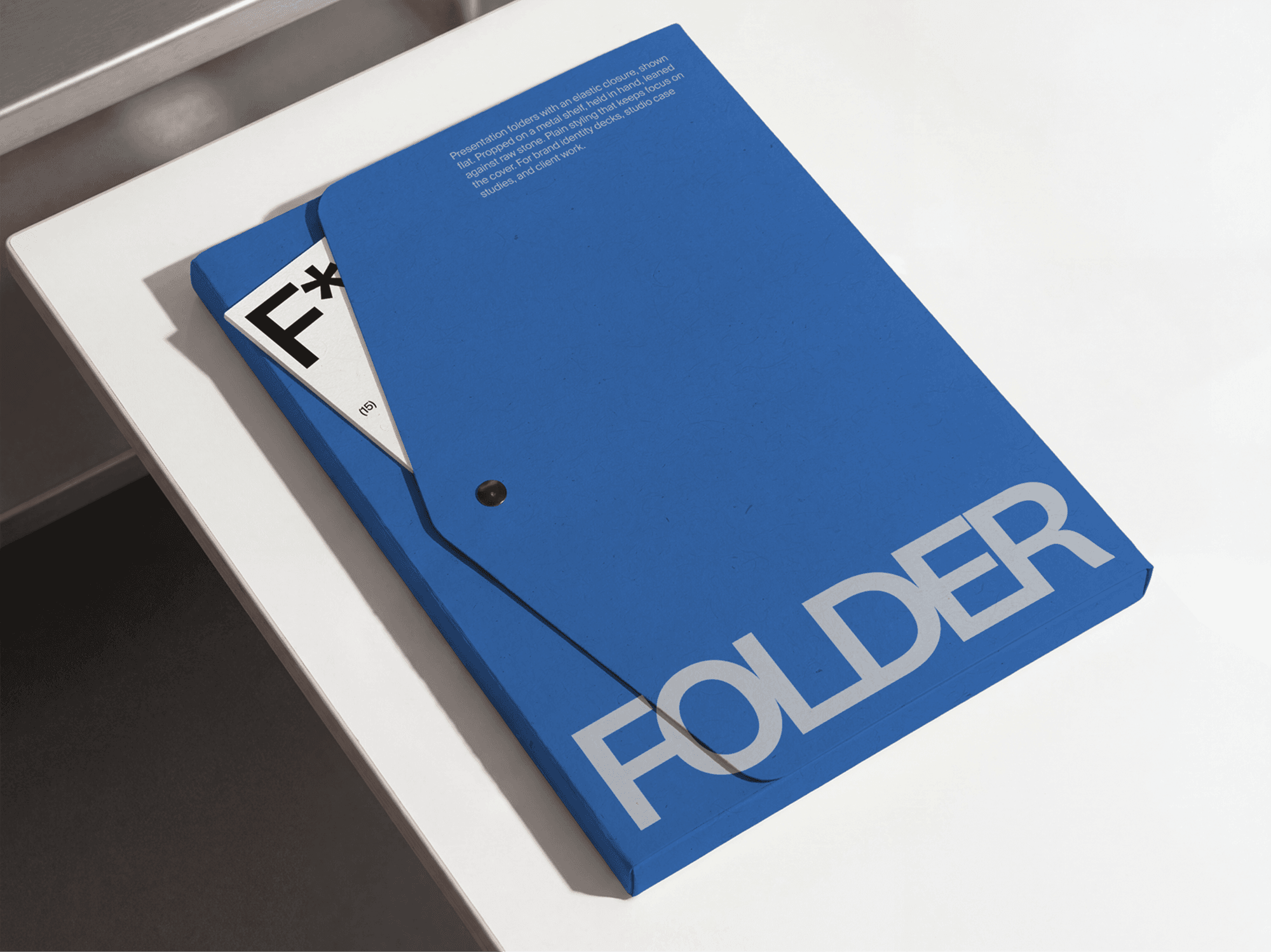 Closed presentation folder mockup placed on a clean modern office desk in a refined studio composition scene