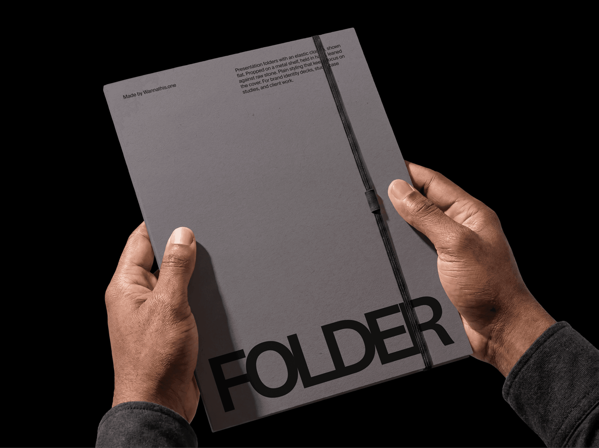 Presentation folder mockup held with both hands in a refined angled studio composition scene
