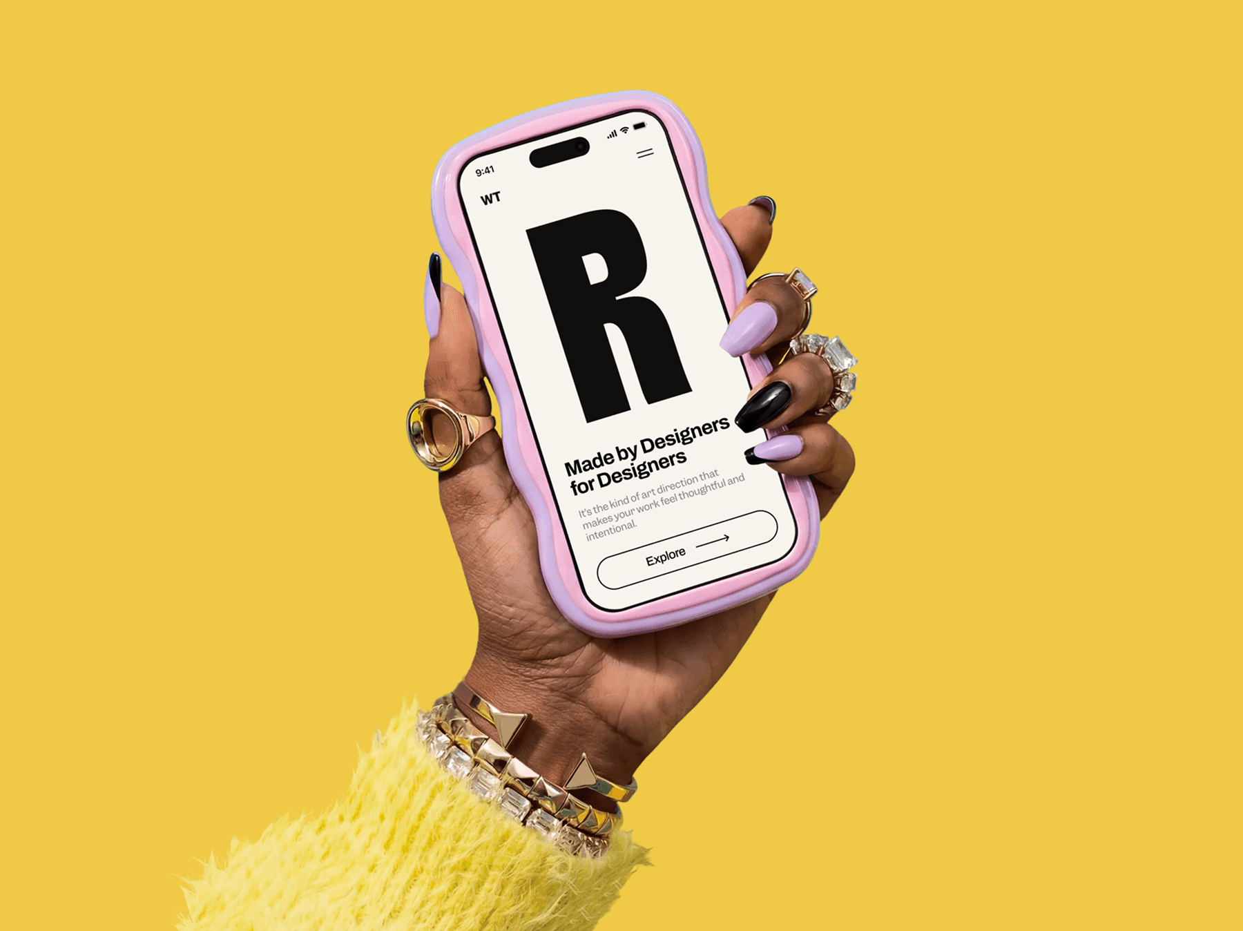 iPhone mockup held in hand wearing rings and bracelets in a studio setup