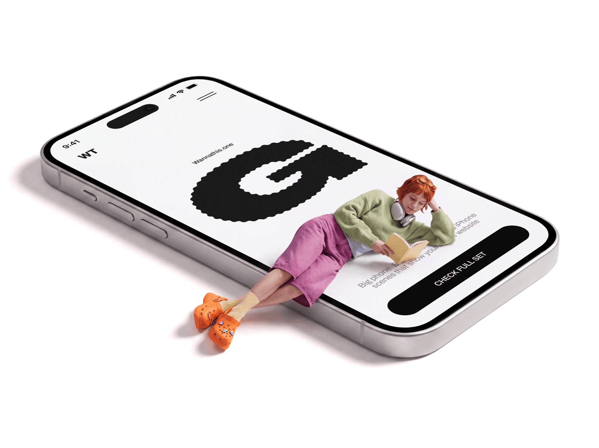 Oversized iPhone tilted on the ground with a person sitting reading on the screen