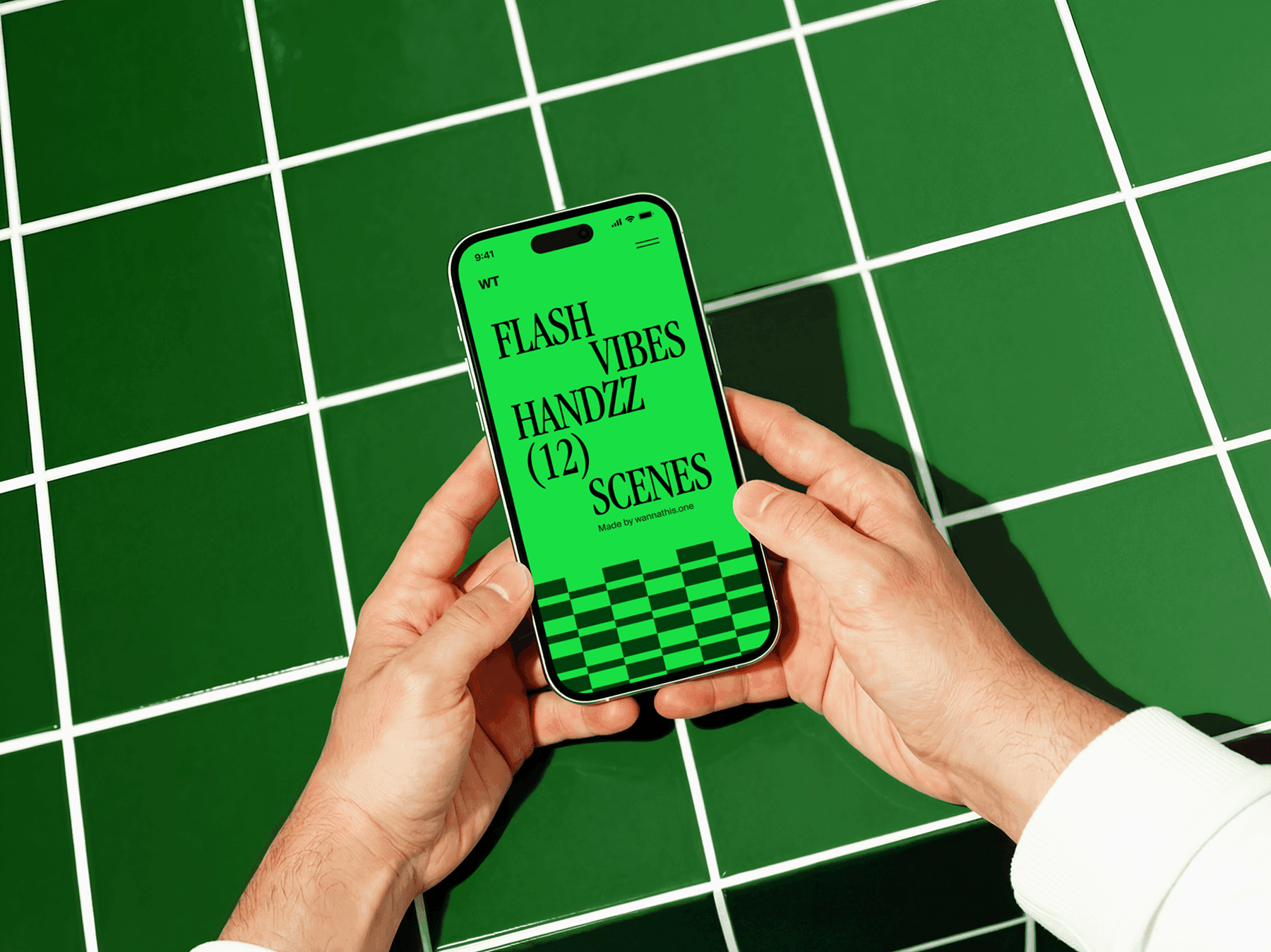 Hands holding an iPhone above a graphic patterned surface indoors