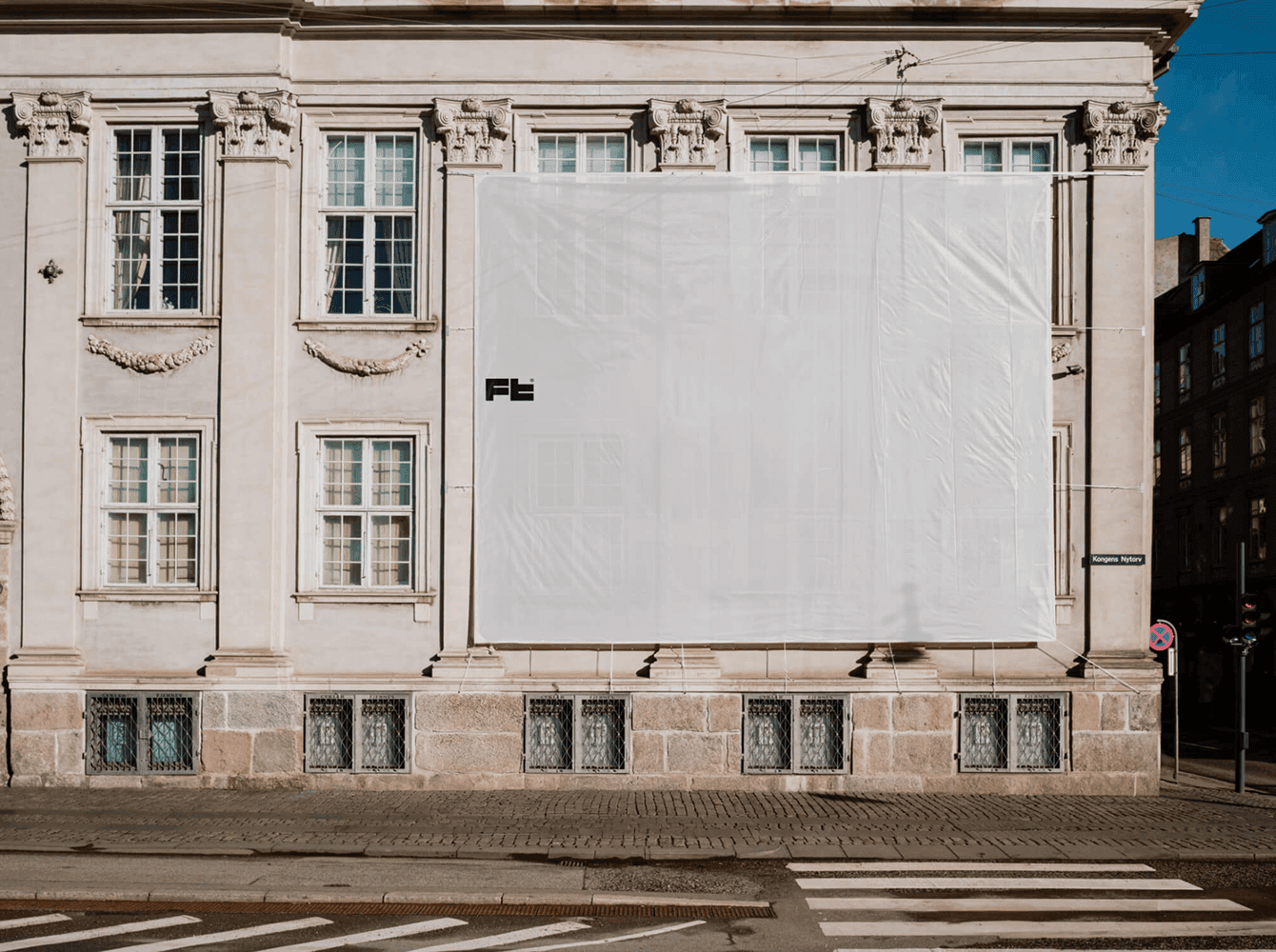 Large billboard mockup on historic building facade