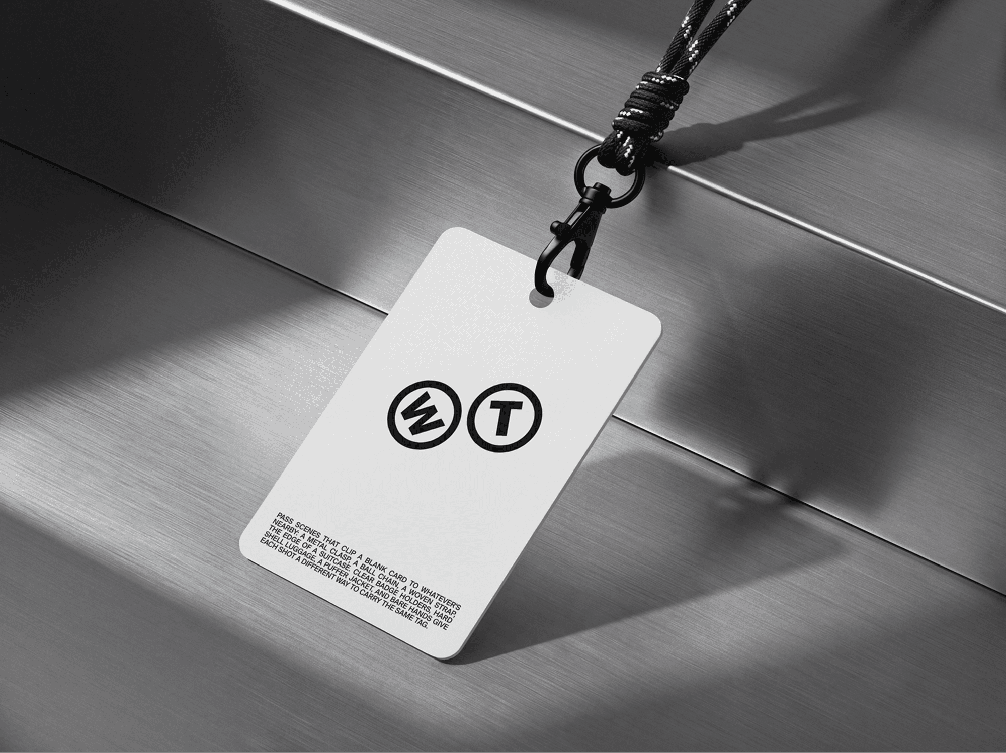 Access pass mockup placed on a brushed metal surface with soft natural shadows in a clean studio scene