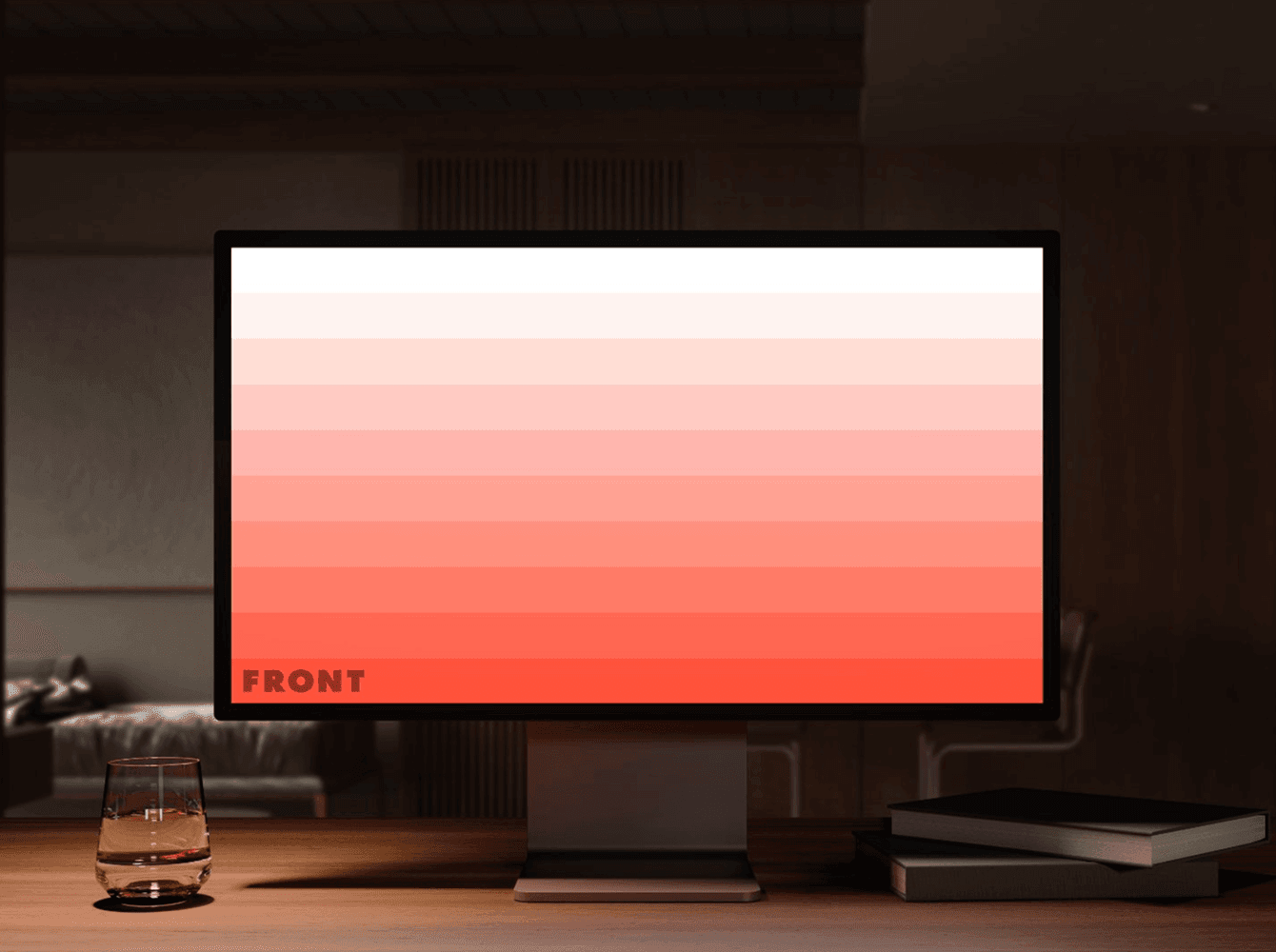 Desktop monitor mockup in dimly lit room — gradient screen display.