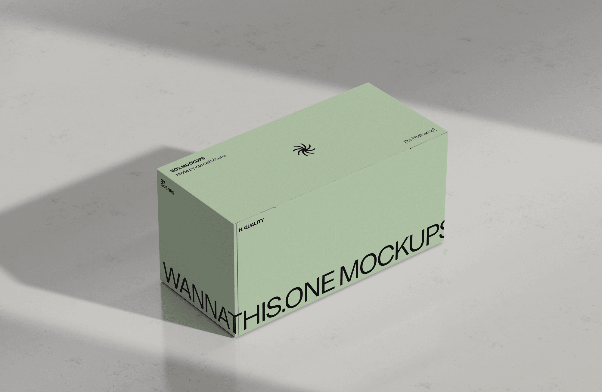 Minimal green product box mockup placed on a light stone surface with realistic shadows